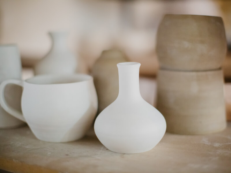 A selection of grey handmade ceramic vases and pots 