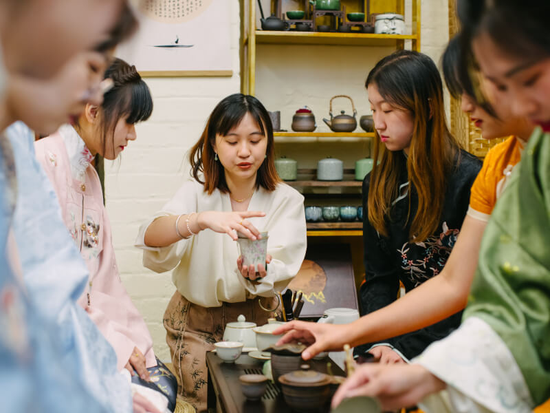 A group of women at a tea tasting ceremony