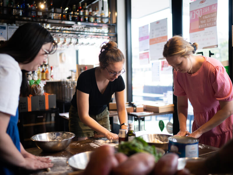 Three woman making gnocchi by hand from scratch